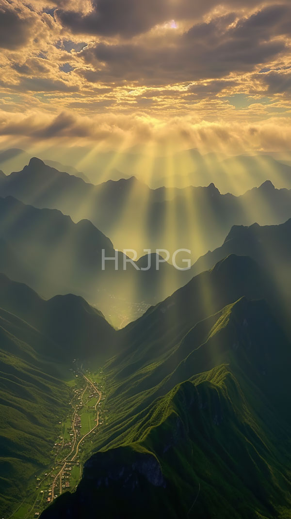 High Resolution: Mountainous landscape sunrise sunlight rays piercing through scattered clouds casting golden glow over green rolling hills download. | HRJPG.com