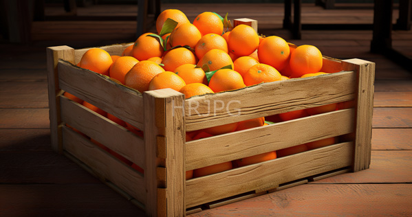High Resolution: Wooden crate filled with bright orange textured oranges some with green leaves attached in a sunlit room over a rustic brown hardwood floor download. | HRJPG.com
