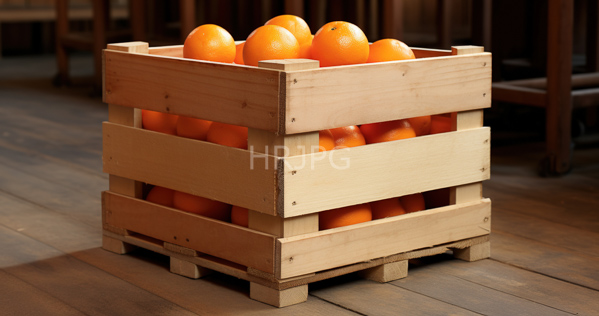 High Resolution: Three wooden crates stacked to form one filled with bright orange oranges on a polished wood floor in a warm indoor lighting setting download. | HRJPG.com