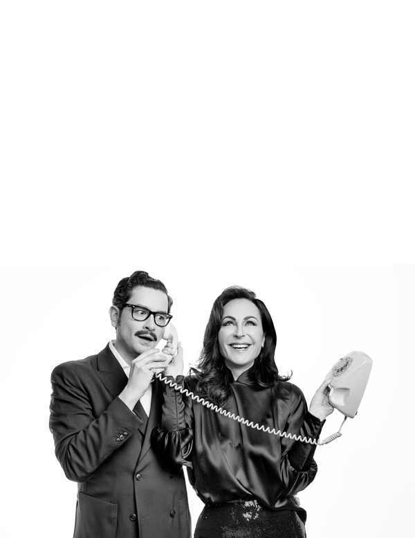 High Resolution: Black-and-white photograph of an Asian man and woman standing against a white background both holding vintage corded telephones with coiled cords download. | HRJPG.com
