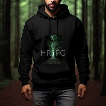 High Resolution: Bearded man with medium brown skin wearing a black hoodie and ripped gray jeans stands in a dim-lit wooded area with tall trees download. | HRJPG.com