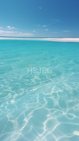 High Resolution: Clear turquoise ocean water with gentle ripples reflecting sunlight extends to the horizon where it meets a pale blue sky and sparse white clouds download. | HRJPG.com