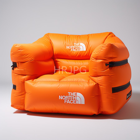 High Resolution: Orange inflatable armchair with a specific brand logo in white on both arms and front cushion features black straps for support against a plain gray background download. | HRJPG.com