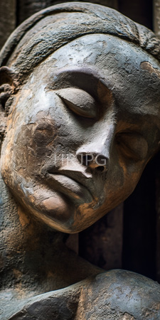 High Resolution: Aged weathered stone sculpture depicting a serene female face with closed eyes and subtle smile download. | HRJPG.com
