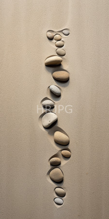 High Resolution: Smooth various-sized pebbles ascending order vertical line beige sand gentle ripples shadows white to large tan-colored ones download. | HRJPG.com