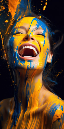 High Resolution: Ecstatic woman with closed eyes and open mouth covered in vibrant blue and orange paint splatters against dark background download. | HRJPG.com