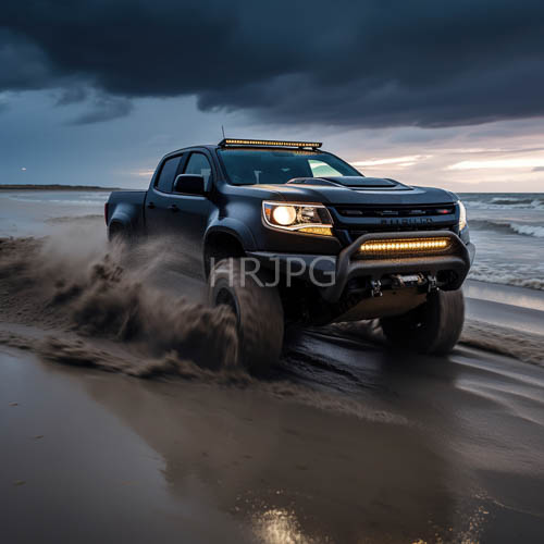 muscular black ford ranger raptor carves path through saturated obsidiantoned sand