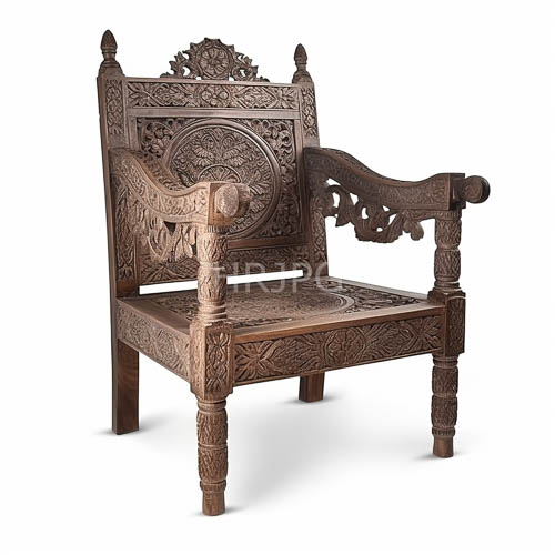 wooden throne with intricate floral and geometric motifs under directional lighting