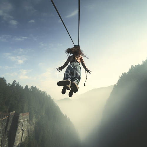 mountain ropes silhouette amidst forested cliffs under filtered sunlight