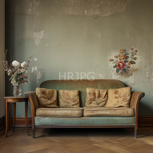 antique green velvet sofas with floralpatterned cushions adorn worn teal wall decorated with faded flower decals