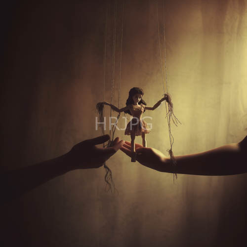 High Resolution: Strings Suspend Tattered Marionette in Dramatic Inky Darkness download. | HRJPG.com