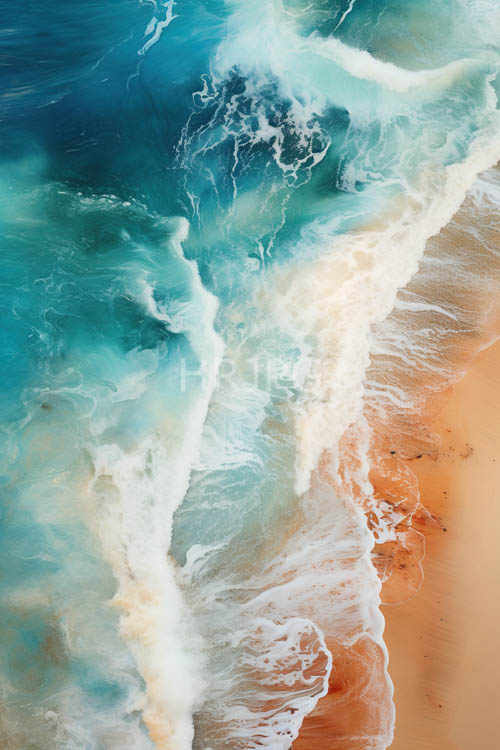 turquoise waves collide with orange sand in a vibrant coastal display of light and texture
