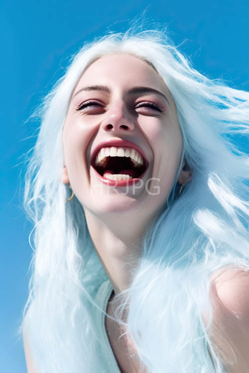 flowing locks surround glowing facial skin in bright light
